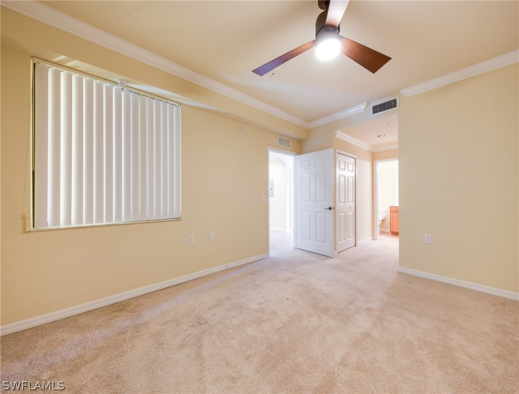 9727 Acqua Court, Unit 413 Naples, FL 34113 - Photo 12 of 35 a view of an empty room with a window