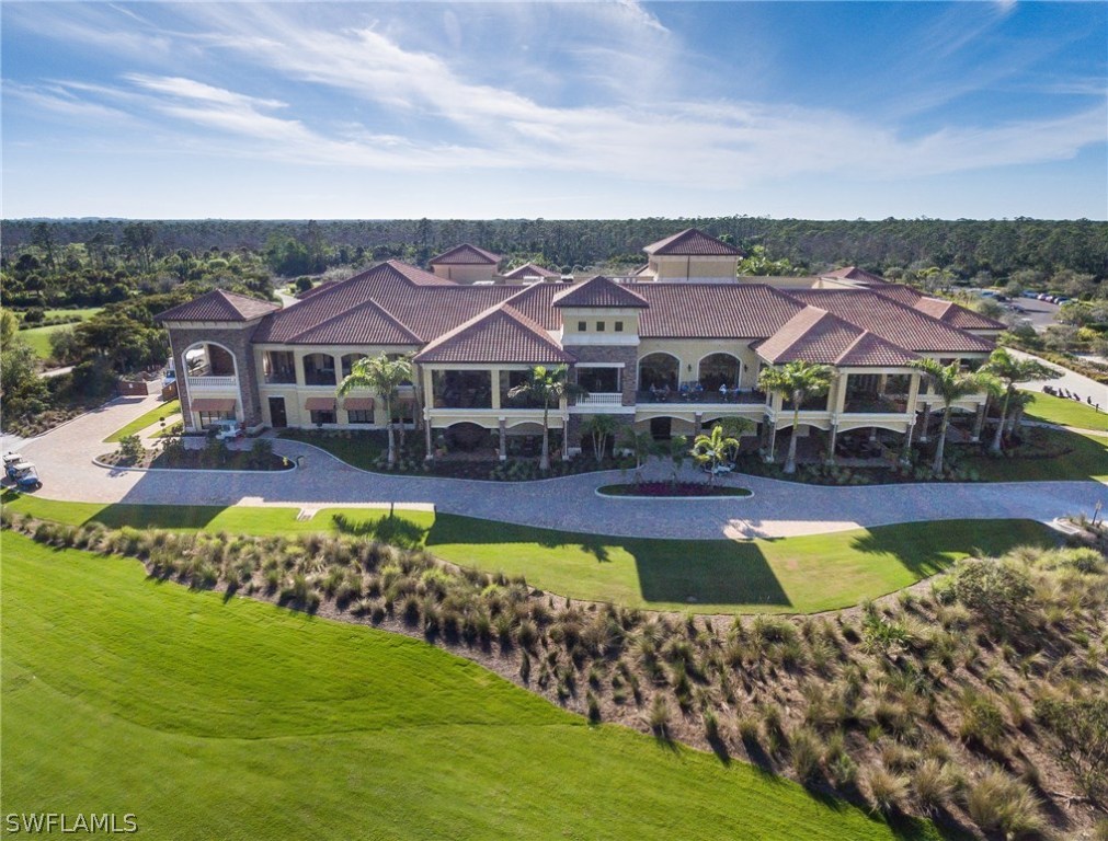 9727 Acqua Court, Unit 413 Naples, FL 34113 - Photo 22 of 35 a swimming pool view with a outdoor seating