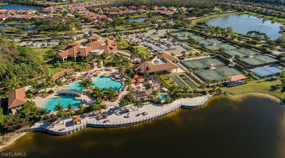 9727 Acqua Court, Unit 413 Naples, FL 34113 - Photo 24 of 35 an aerial view of residential houses with outdoor space and swimming pool