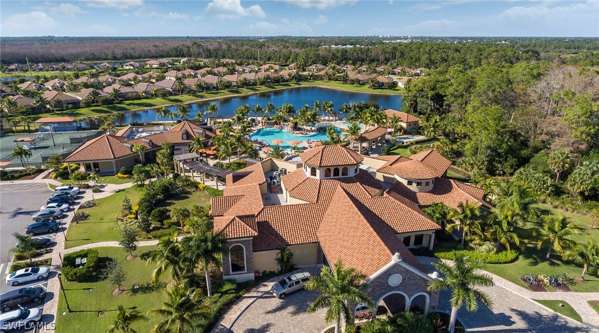 9727 Acqua Court, Unit 413 Naples, FL 34113 - Photo 25 of 35 an aerial view of residential houses with outdoor space
