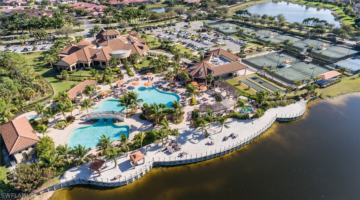 9727 Acqua Court, Unit 413 Naples, FL 34113 - Photo 26 of 35 an aerial view of residential houses with outdoor space and swimming pool
