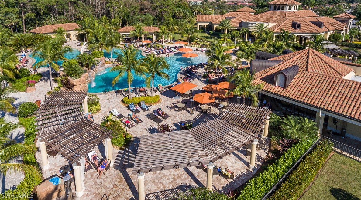 9727 Acqua Court, Unit 413 Naples, FL 34113 - Photo 29 of 35 an aerial view of residential houses with outdoor space