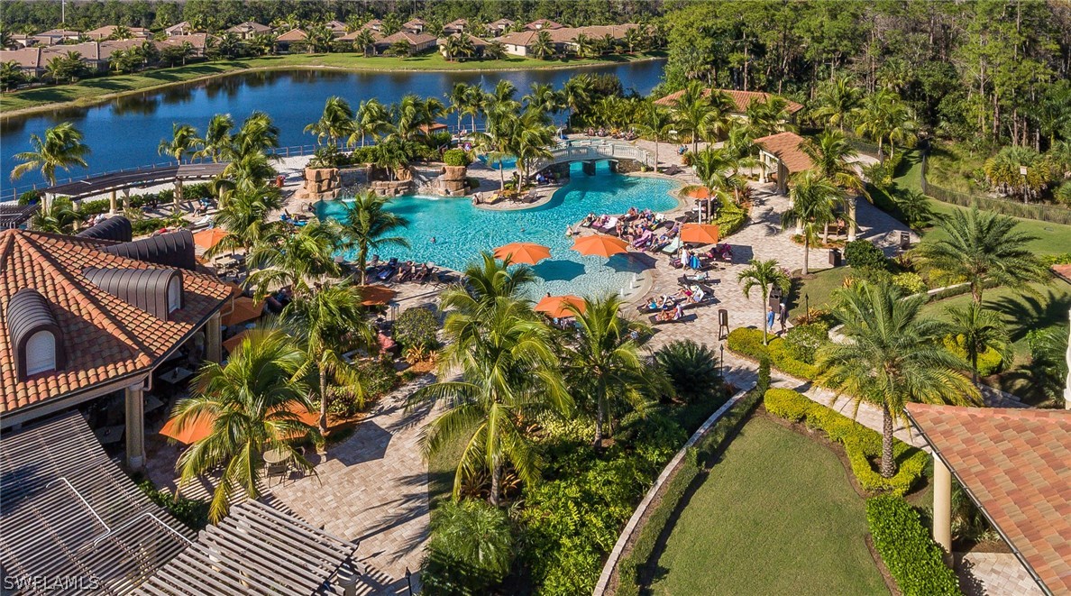 9727 Acqua Court, Unit 413 Naples, FL 34113 - Photo 30 of 35 a view of a potted flower in a garden