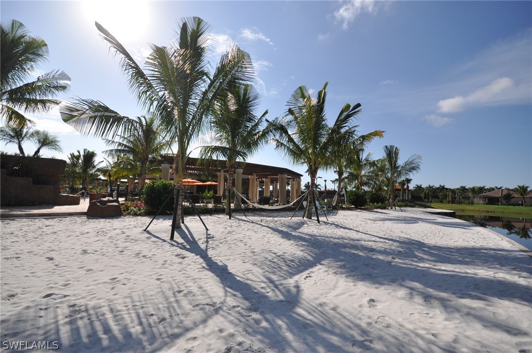9727 Acqua Court, Unit 413 Naples, FL 34113 - Photo 33 of 35 a view of a backyard with a sitting area