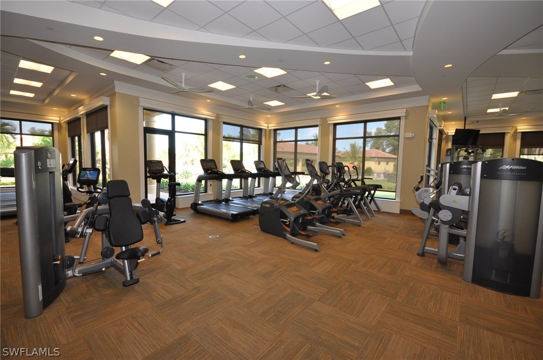 9727 Acqua Court, Unit 413 Naples, FL 34113 - Photo 35 of 35 a view of a room with gym equipment