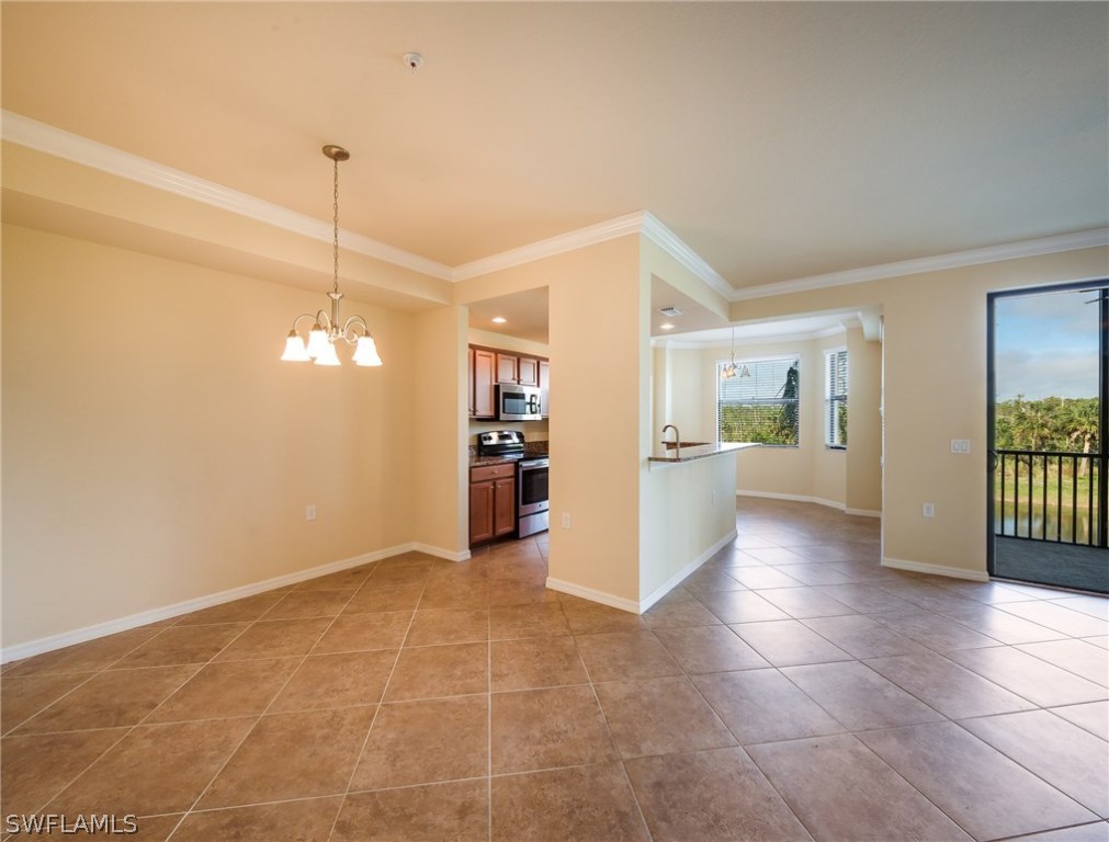 9727 Acqua Court, Unit 413 Naples, FL 34113 - Photo 6 of 35 a view of a kitchen with a sink