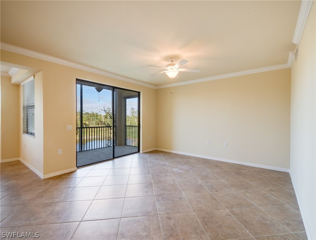 9727 Acqua Court, Unit 413 Naples, FL 34113 - Photo 7 of 35 a view of an empty room with glass door