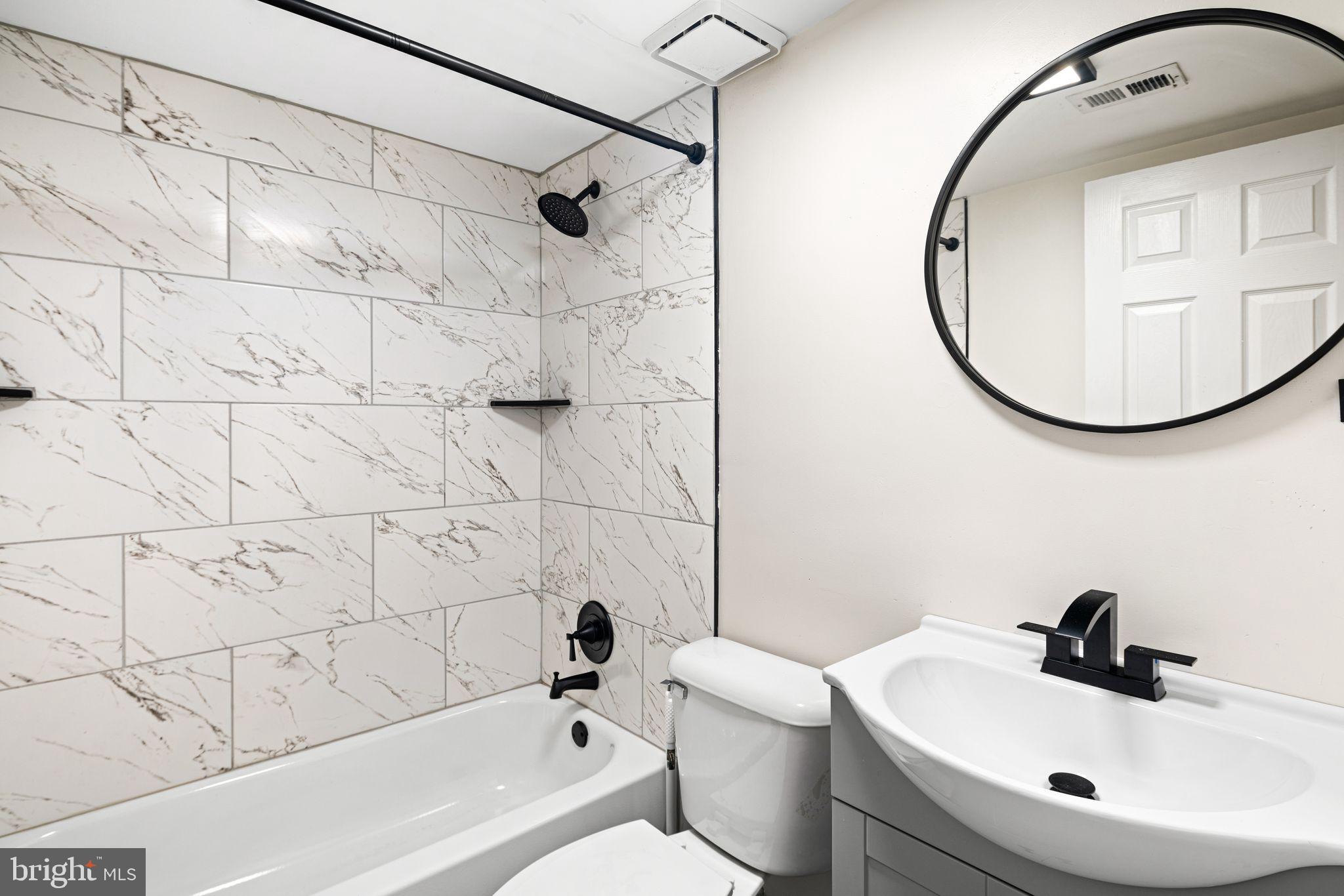 7926 Cottage Street Philadelphia, PA 19136 - Photo 15 of 29 a bathroom with a sink toilet and shower