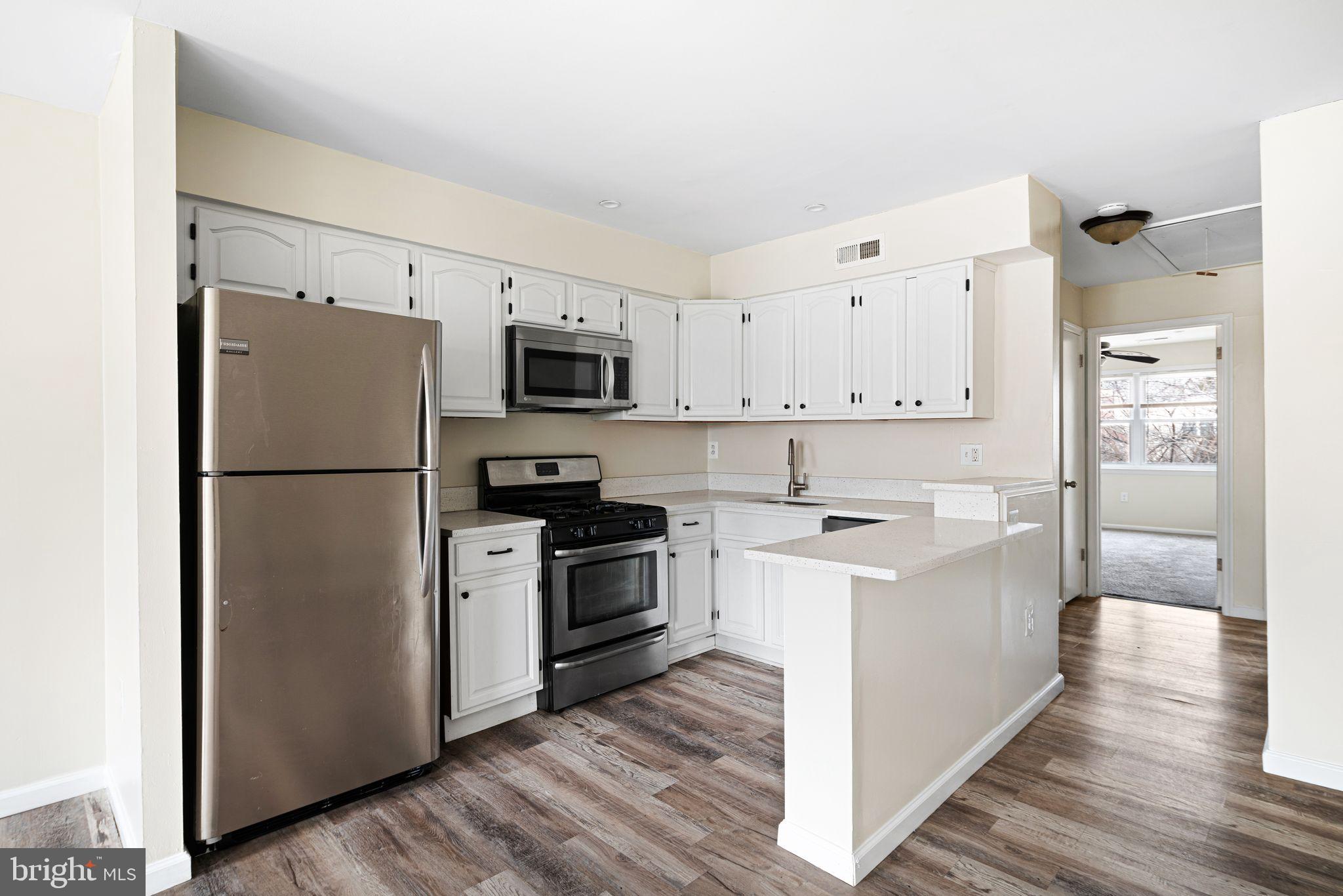 7926 Cottage Street Philadelphia, PA 19136 - Photo 19 of 29 a kitchen with a refrigerator stove and sink