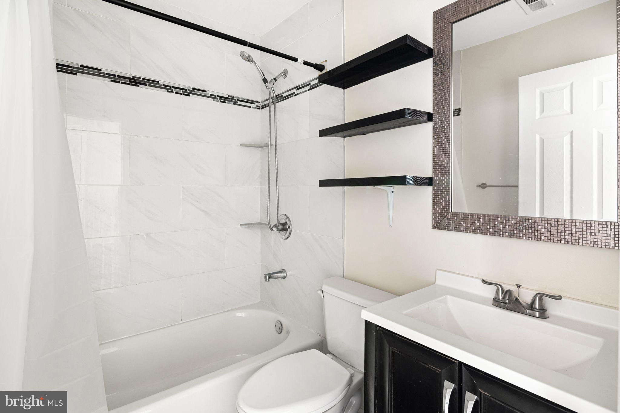 7926 Cottage Street Philadelphia, PA 19136 - Photo 21 of 29 a bathroom with a sink toilet tub and shower