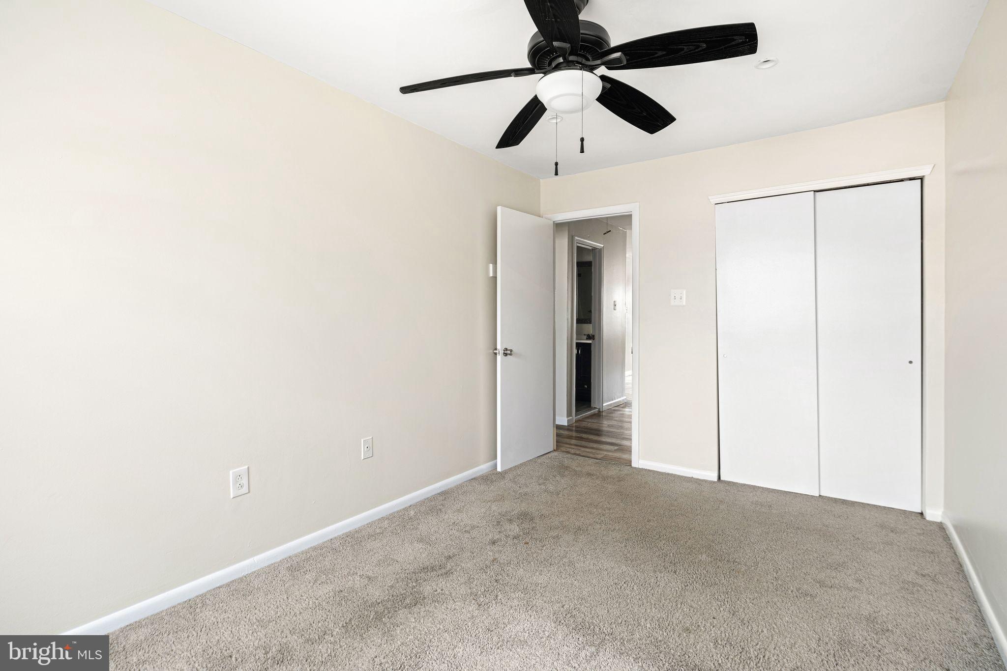 7926 Cottage Street Philadelphia, PA 19136 - Photo 24 of 29 an empty room with a ceiling fan and a ceiling fan