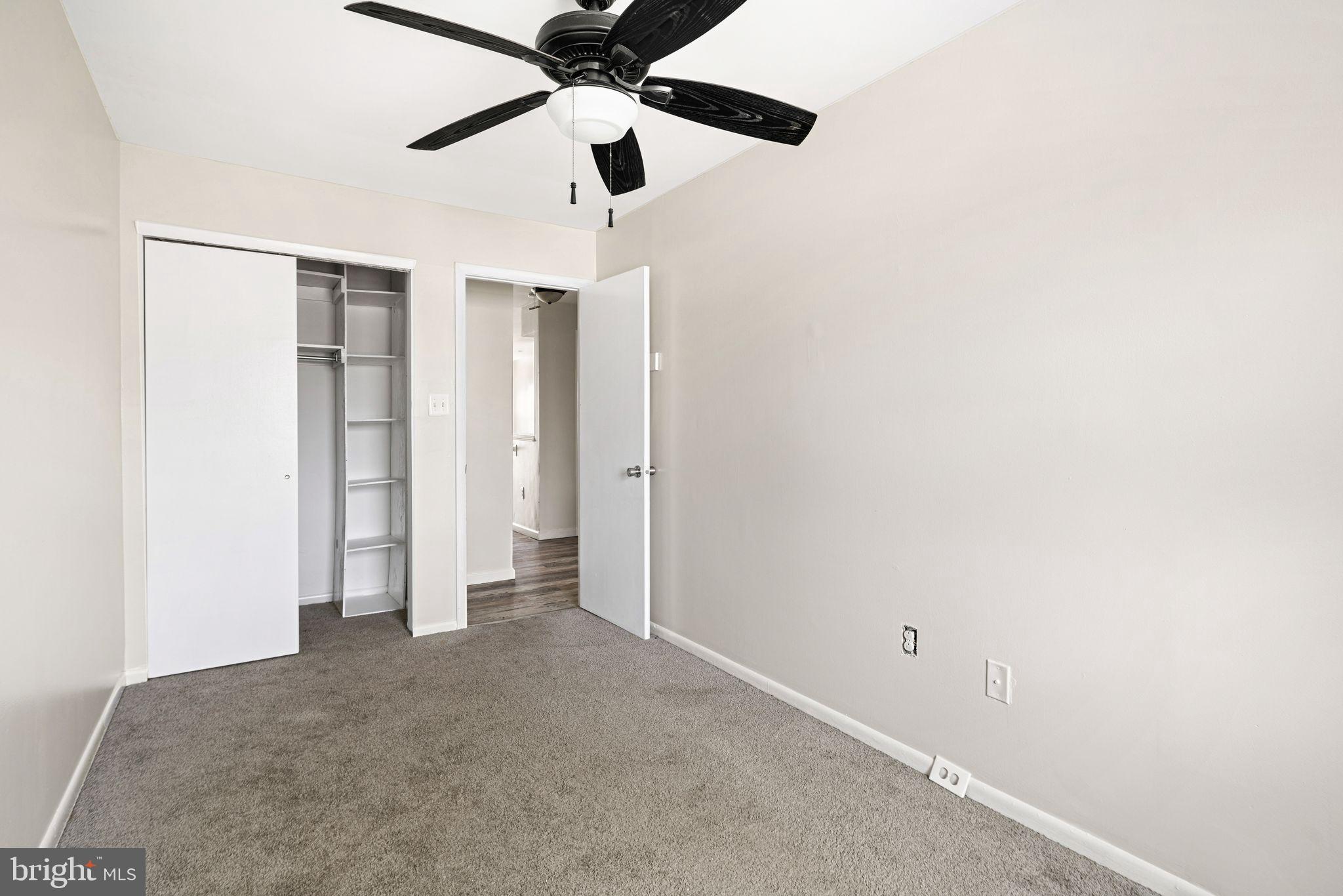 7926 Cottage Street Philadelphia, PA 19136 - Photo 26 of 29 an empty room with closet and a ceiling fan