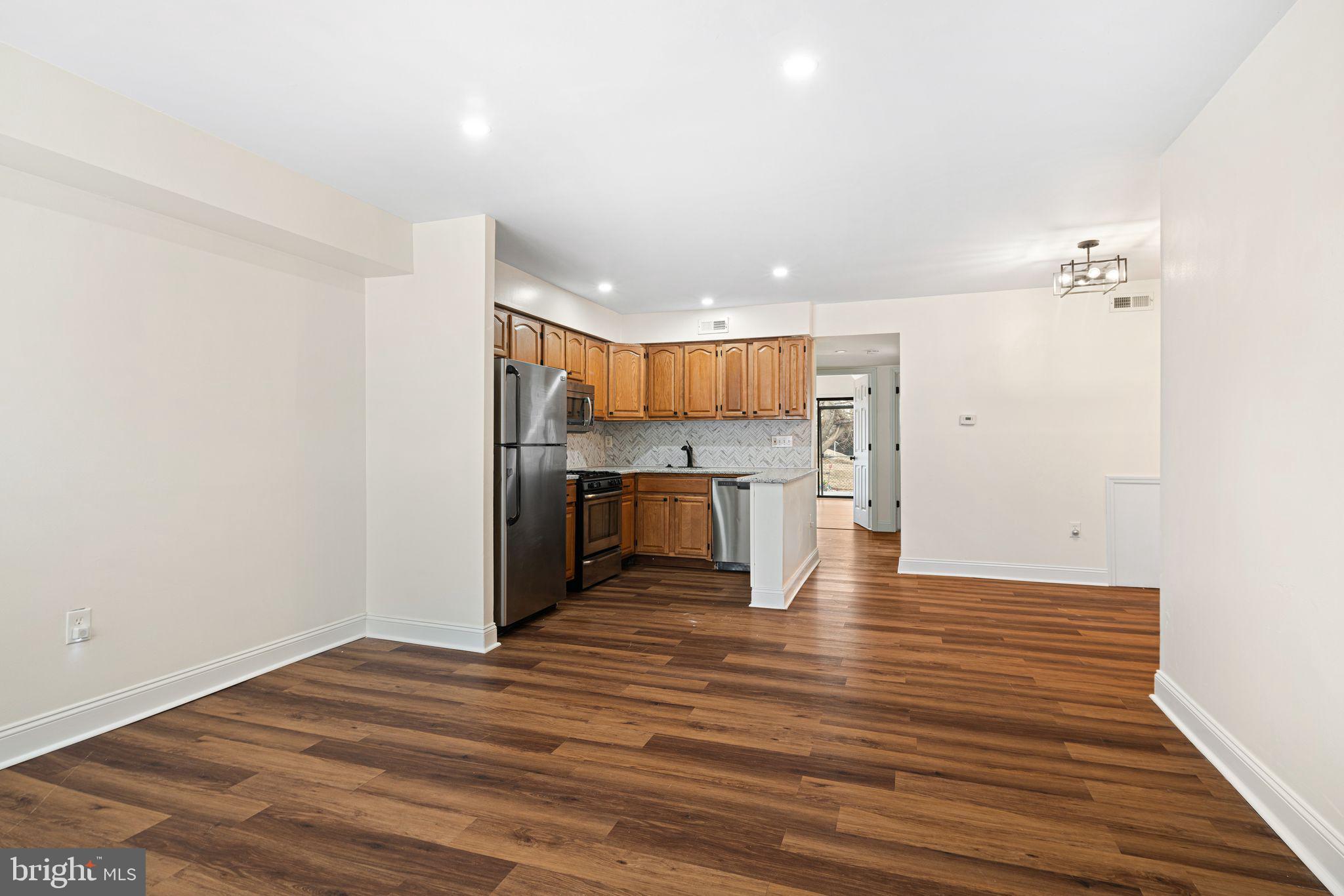 7926 Cottage Street Philadelphia, PA 19136 - Photo 4 of 29 a view of kitchen living room with wooden floor