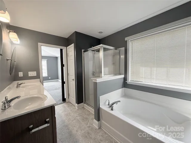 a bathroom with a sink a vanity and a mirror