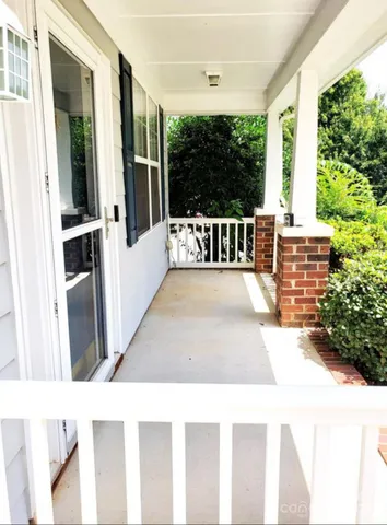 a view of a hallway with staircase
