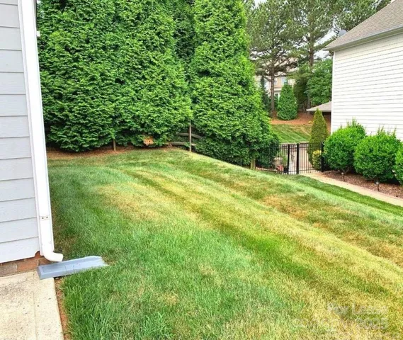 a front view of house with a garden