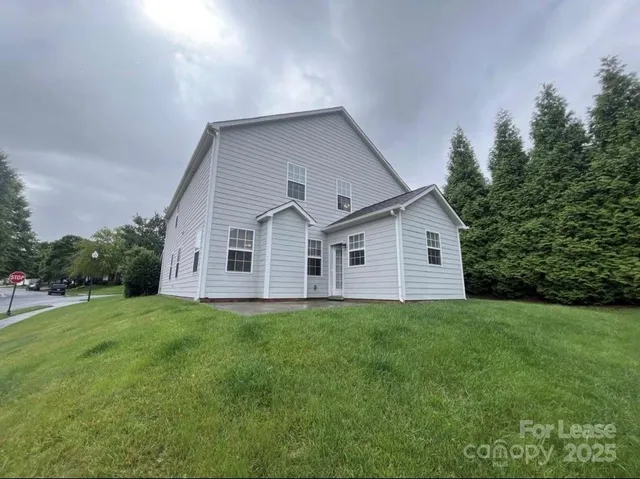a view of swimming pool with outdoor seating and plants