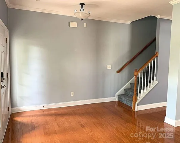 a view of livingroom with window and hardwood floor