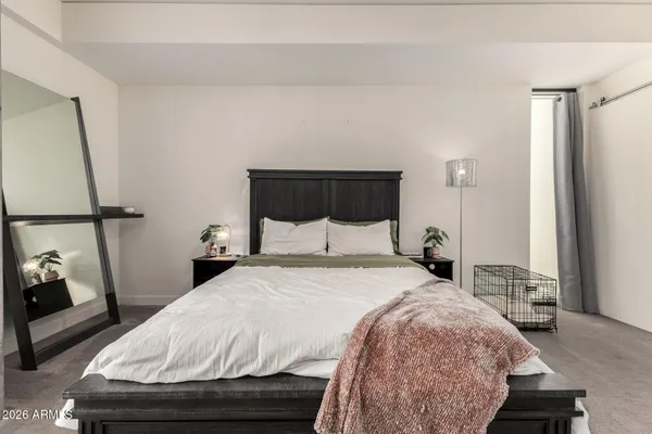 a bedroom with a bed and window