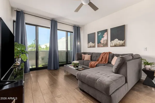 a living room with furniture and a flat screen tv