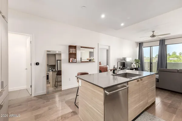 a kitchen that has a sink and a stove in it