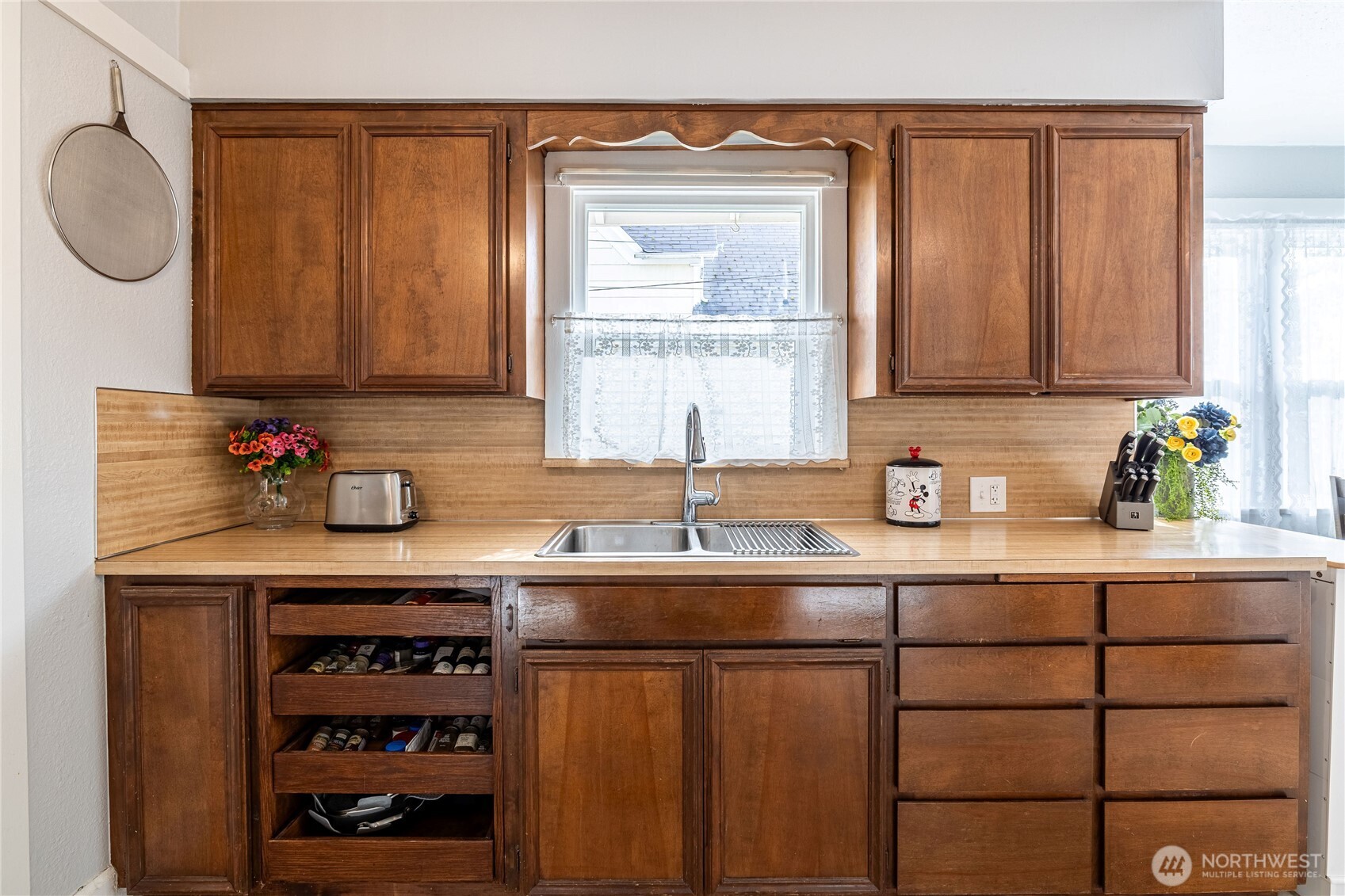 318 4th Street Southwest Puyallup, WA 98371 - Photo 15 of 40 a kitchen with granite countertop a sink cabinets and wooden floor
