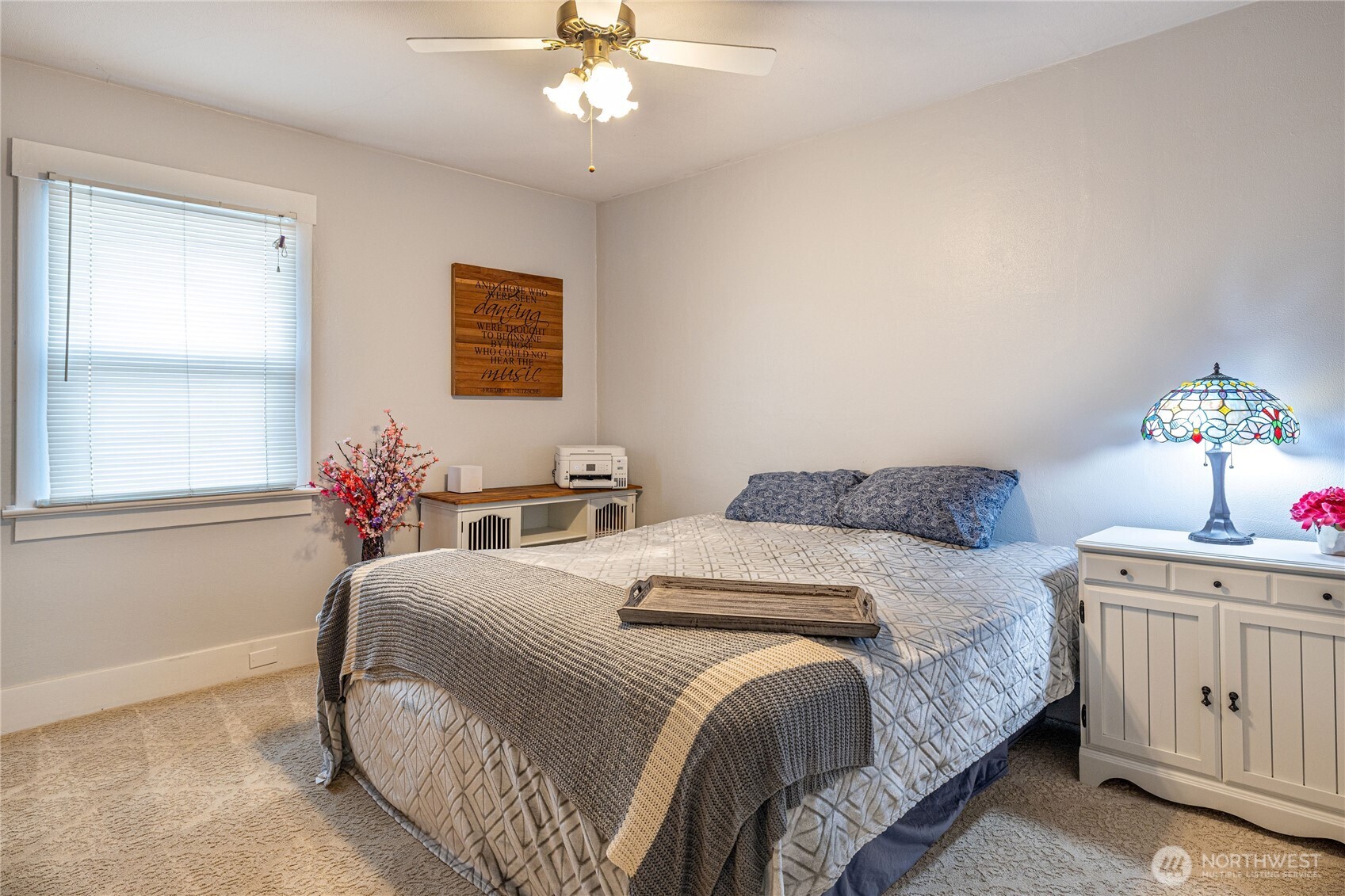 318 4th Street Southwest Puyallup, WA 98371 - Photo 19 of 40 a bedroom with a bed and a chandelier