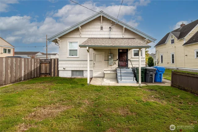 a kitchen with a refrigerator and a stove top oven