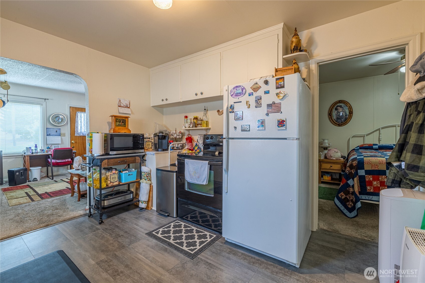 318 4th Street Southwest Puyallup, WA 98371 - Photo 32 of 40 a kitchen with a refrigerator and a stove top oven