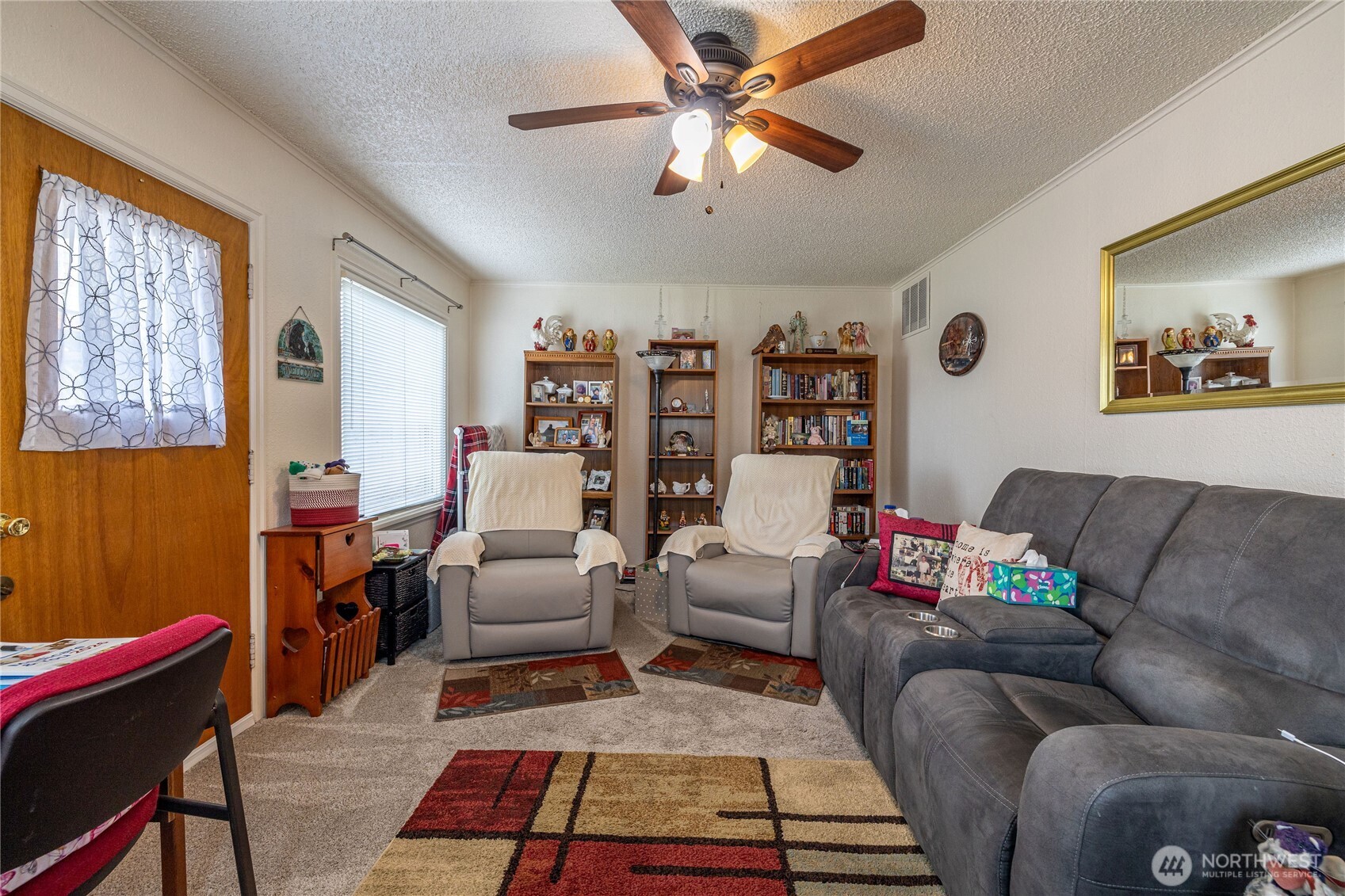 318 4th Street Southwest Puyallup, WA 98371 - Photo 33 of 40 a living room with furniture and a rug