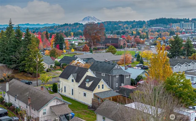 an aerial view of a house with a yard