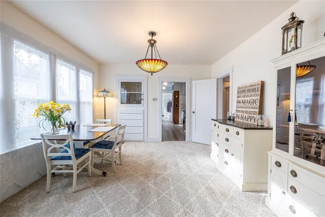 a dining room with furniture and window