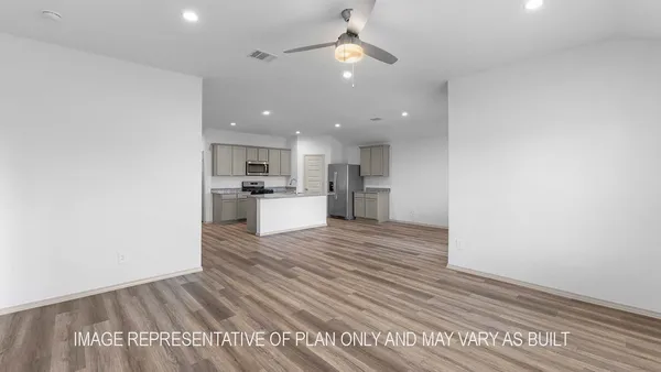 a view of kitchen view with cabinets and wooden floor