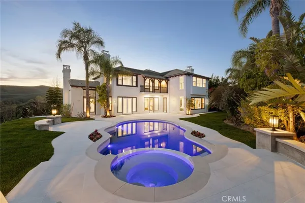 a view of a house with swimming pool