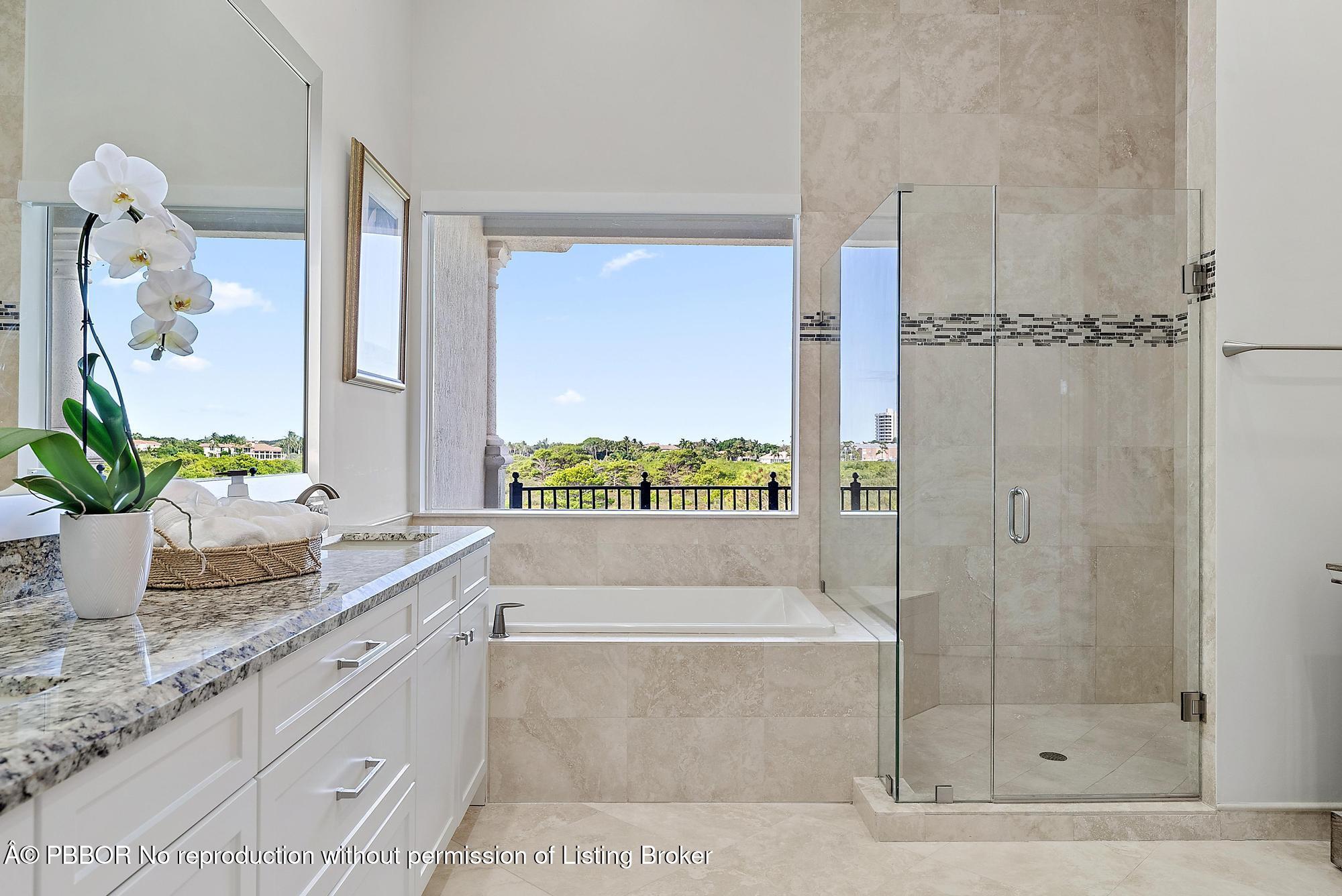 138 Tierra Lane, Unit 6 Jupiter, FL 33477 - Photo 18 of 41 a bathroom with a granite countertop sink a mirror and shower