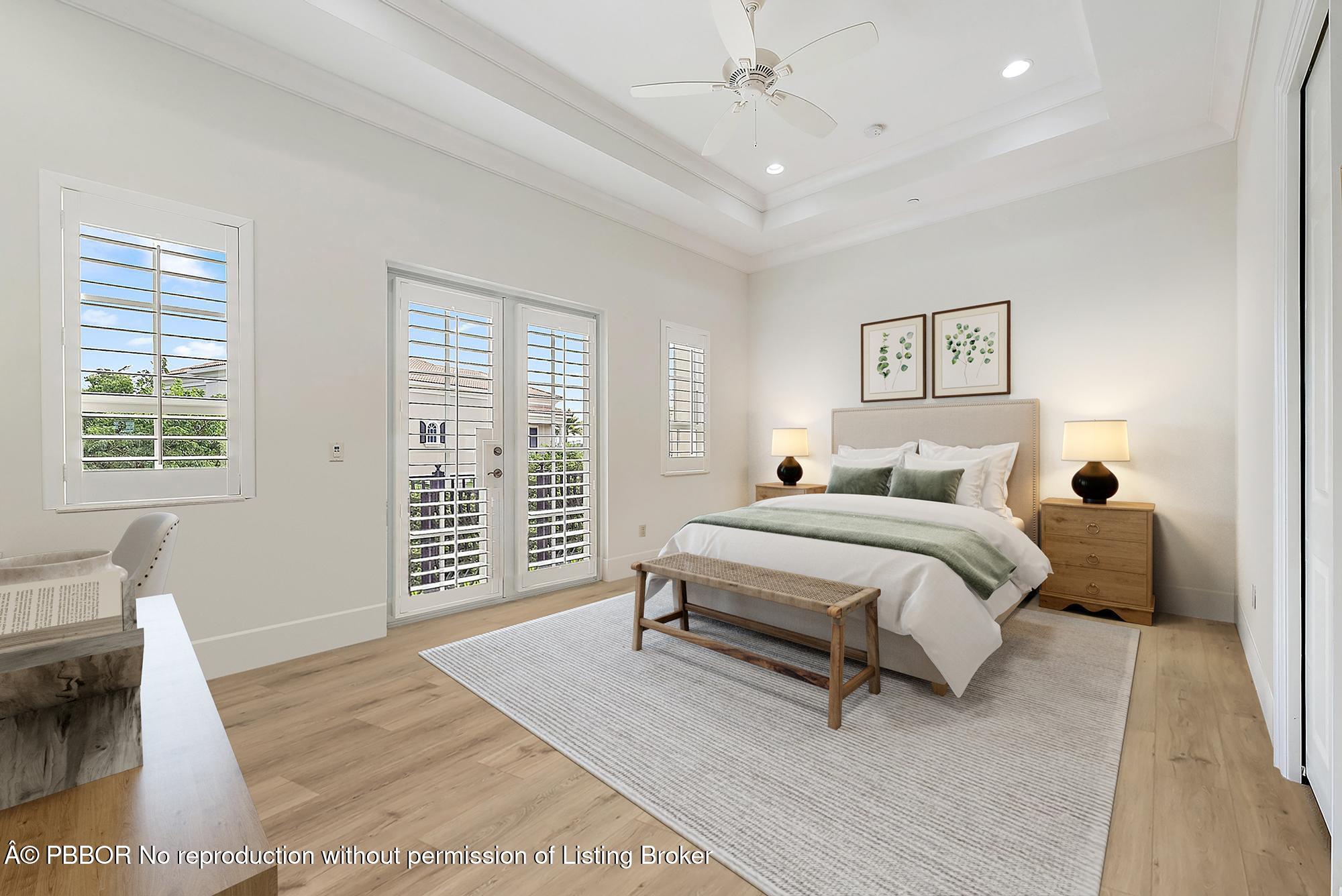 138 Tierra Lane, Unit 6 Jupiter, FL 33477 - Photo 19 of 41 a bedroom with a bed a couch and a window