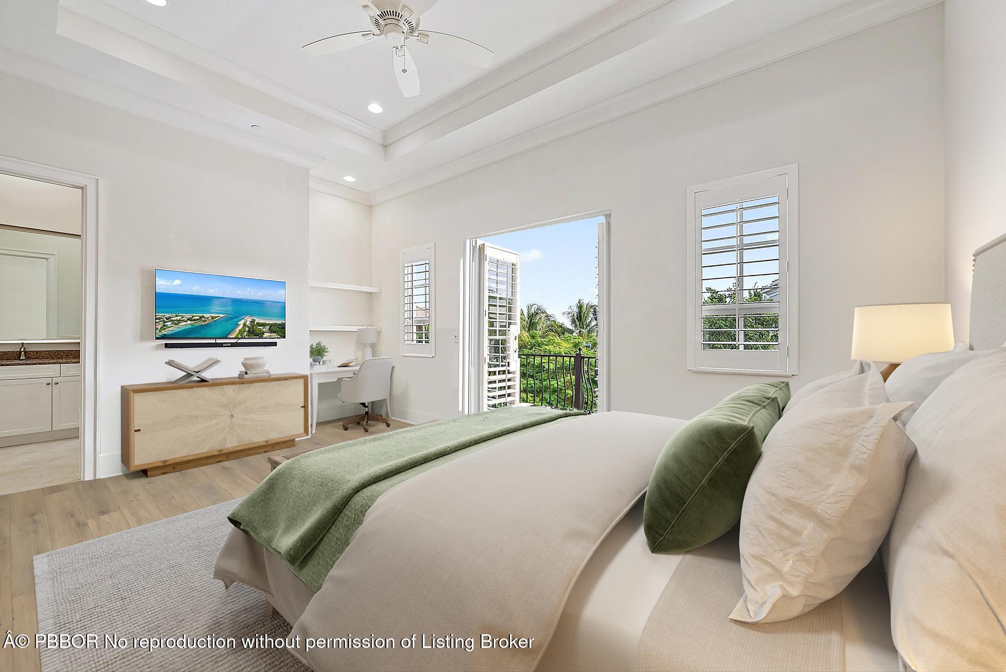 138 Tierra Lane, Unit 6 Jupiter, FL 33477 - Photo 20 of 41 a bedroom with a large bed and a window