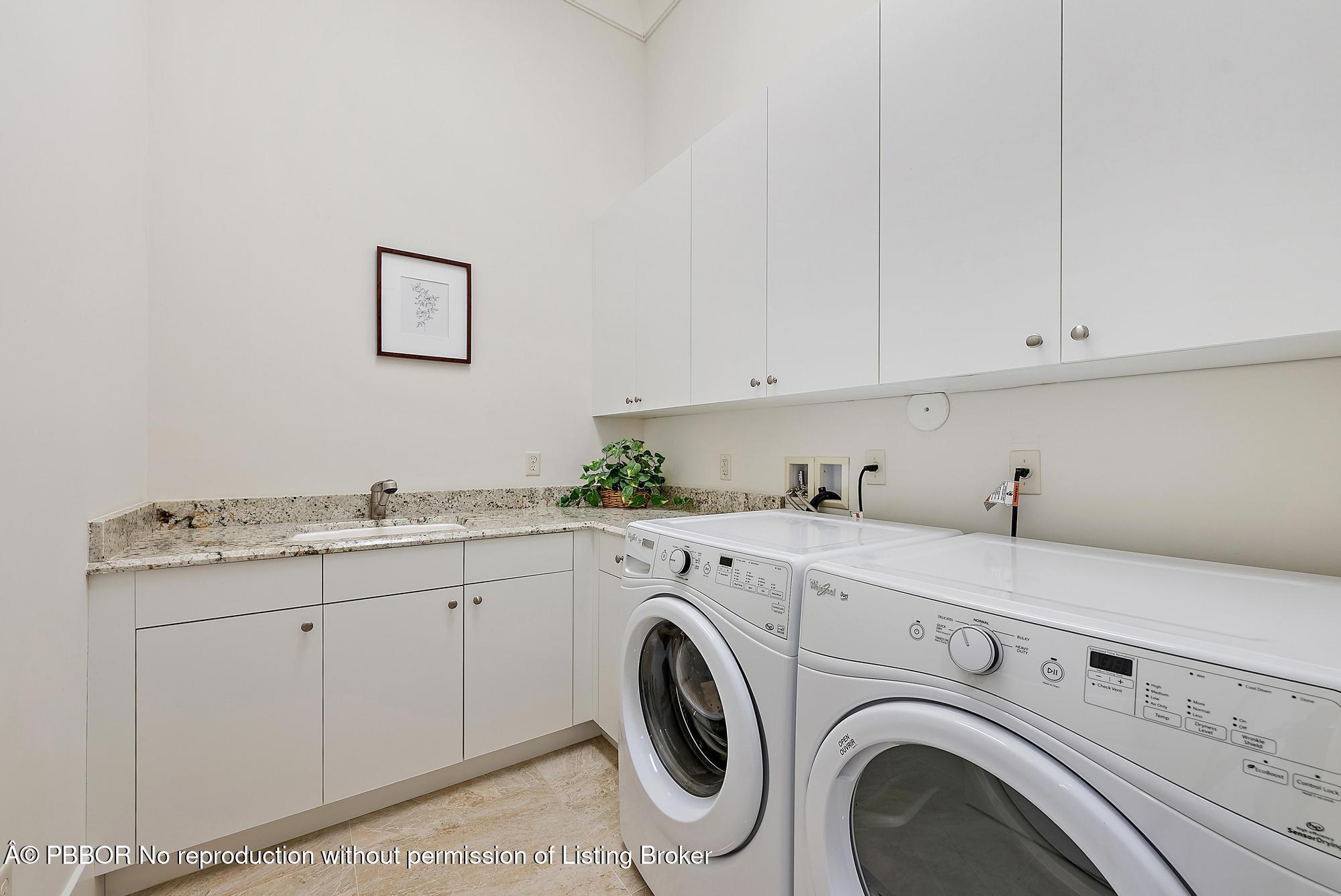 138 Tierra Lane, Unit 6 Jupiter, FL 33477 - Photo 22 of 41 a utility room with dryer and washer