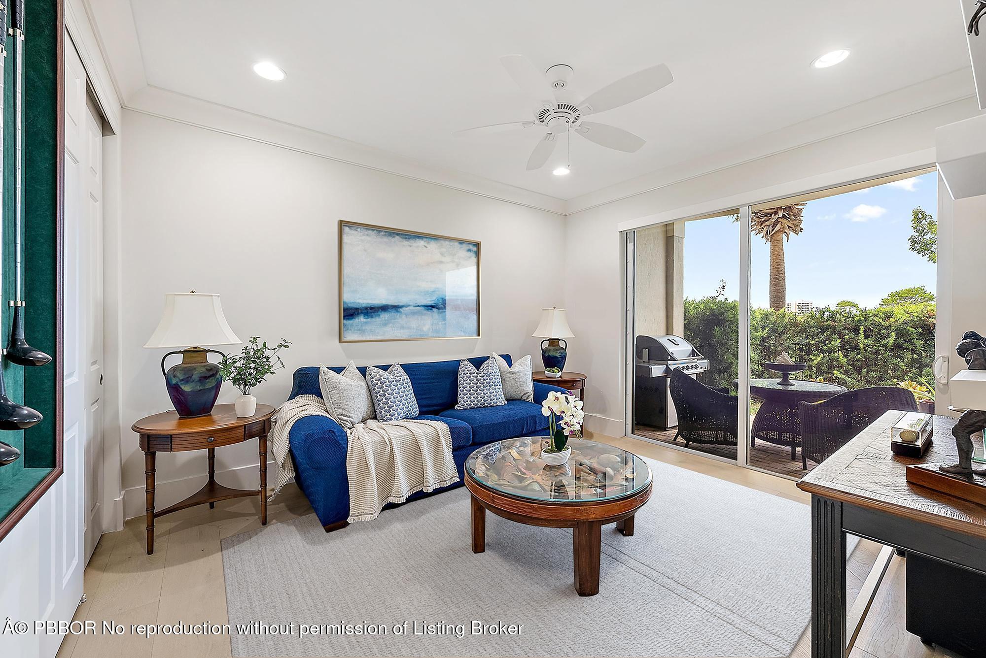 138 Tierra Lane, Unit 6 Jupiter, FL 33477 - Photo 27 of 41 a living room with furniture and a large window