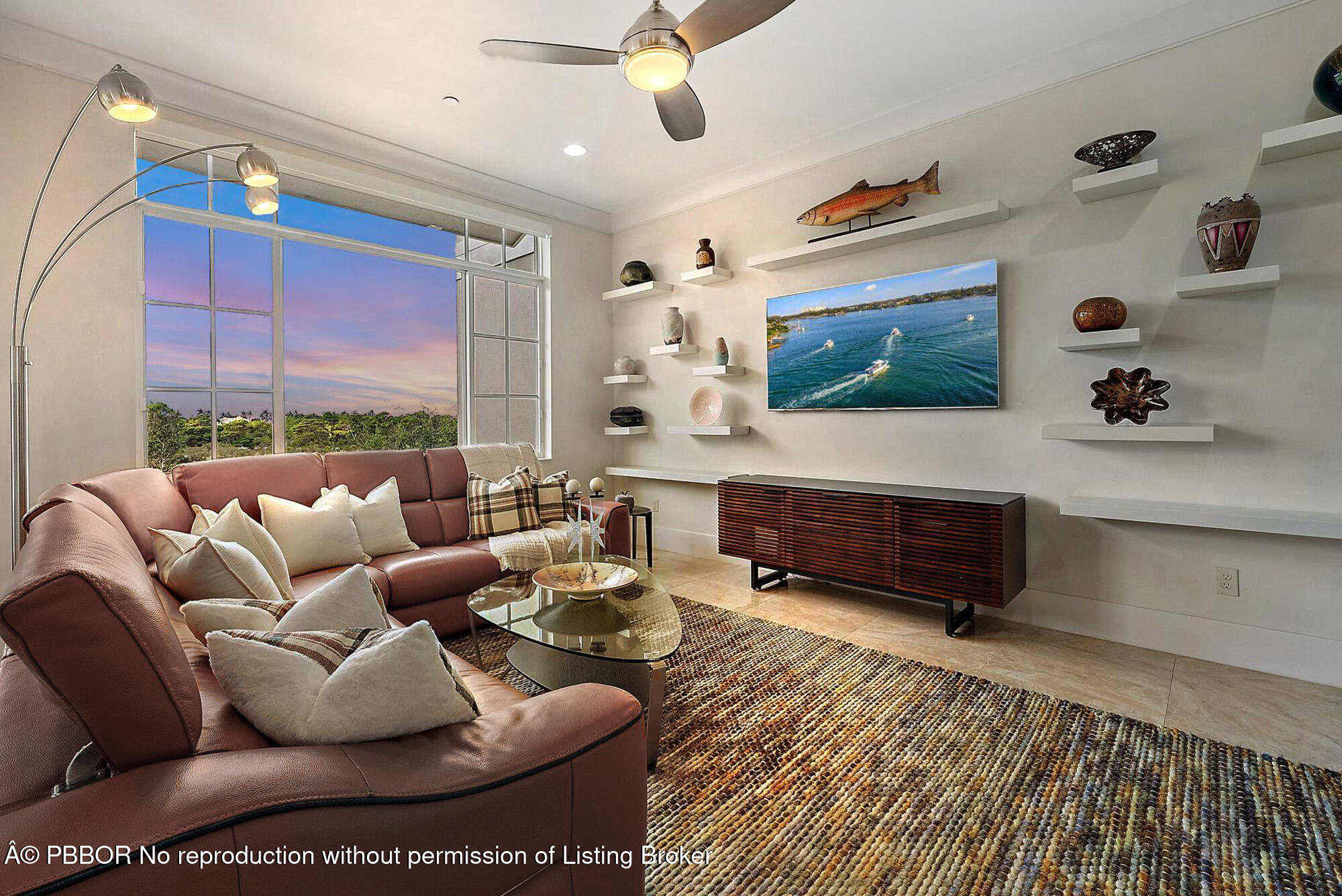 138 Tierra Lane, Unit 6 Jupiter, FL 33477 - Photo 32 of 41 a living room with furniture and a flat screen tv