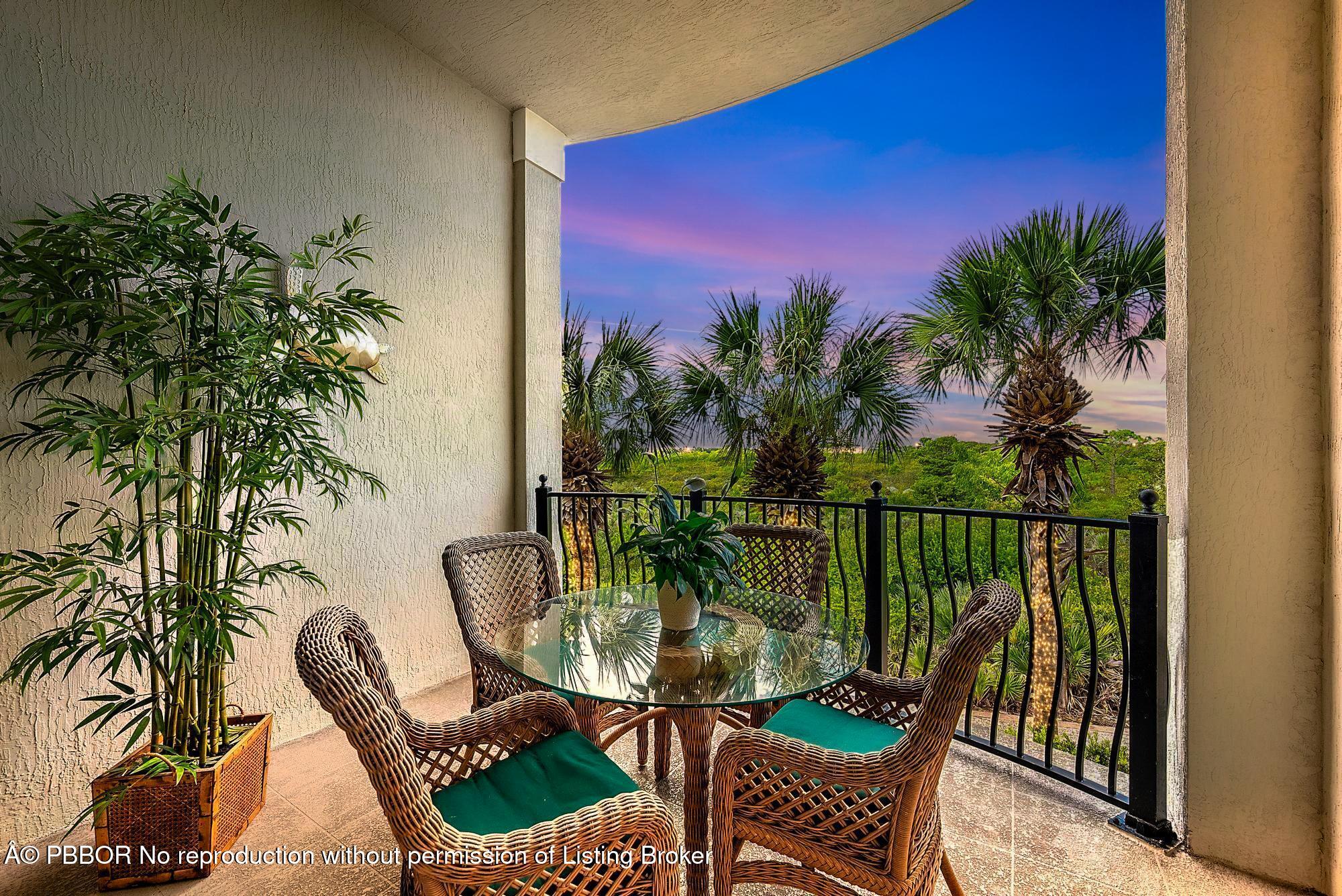 138 Tierra Lane, Unit 6 Jupiter, FL 33477 - Photo 33 of 41 a view of a balcony with chair and table
