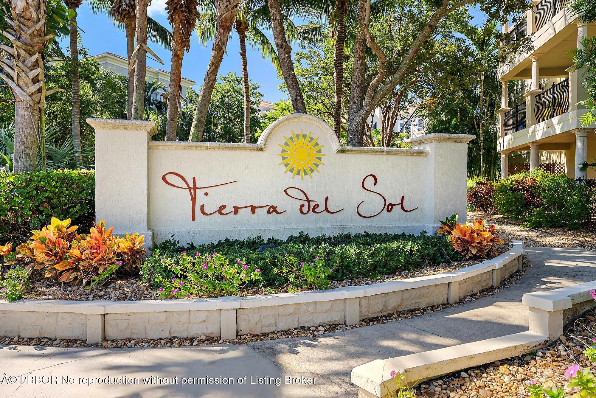 138 Tierra Lane, Unit 6 Jupiter, FL 33477 - Photo 34 of 41 a sign that is on the side of a road