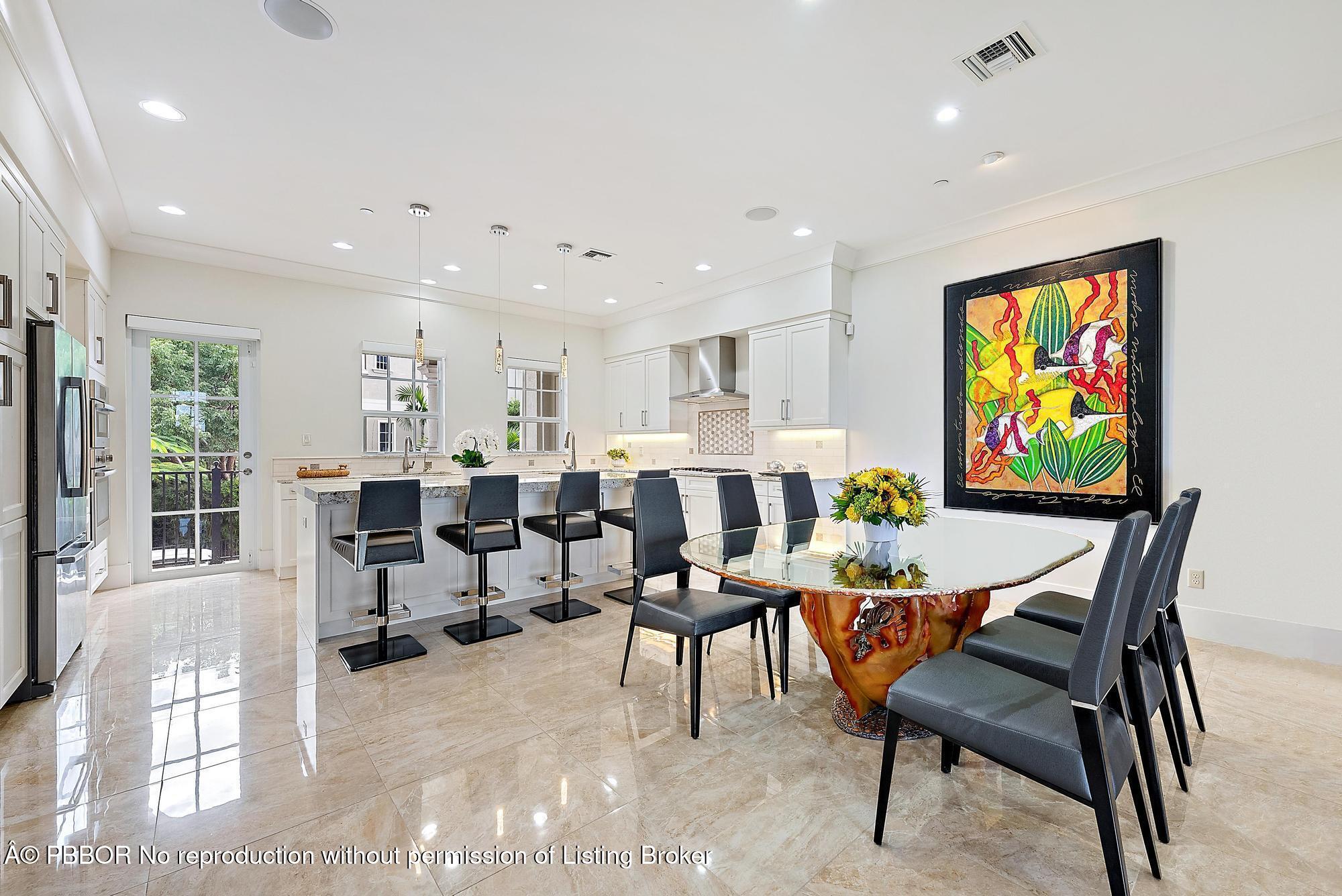 138 Tierra Lane, Unit 6 Jupiter, FL 33477 - Photo 7 of 41 a view of a dining room with furniture