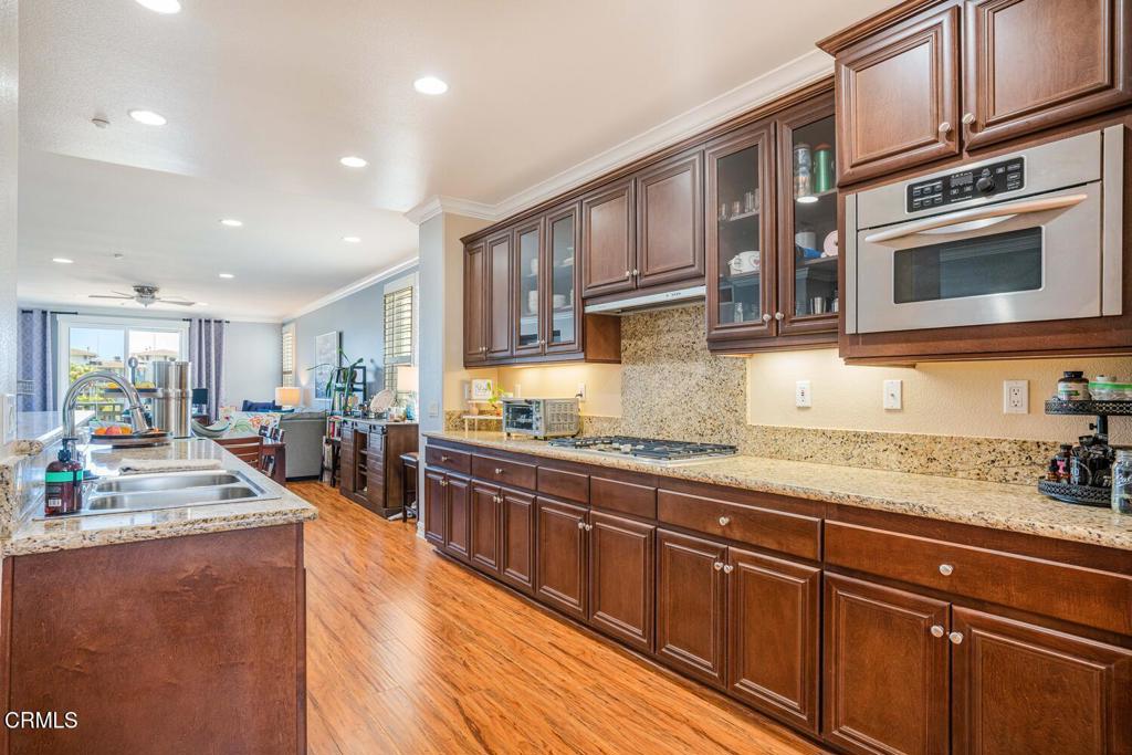 1541 Windshore Way Oxnard, CA 93035 - Photo 11 of 42 a large kitchen with stainless steel appliances and a large counter top
