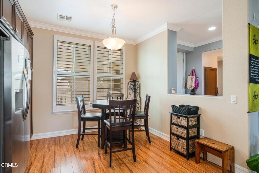 1541 Windshore Way Oxnard, CA 93035 - Photo 12 of 42 a view of a dining room with furniture window and wooden floor
