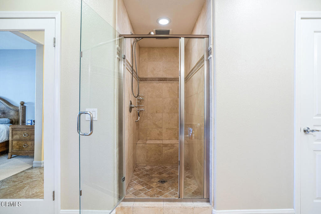 1541 Windshore Way Oxnard, CA 93035 - Photo 23 of 42 a bathroom with a glass shower door