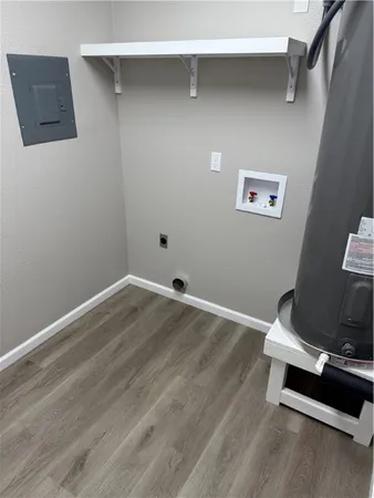 a room with a wooden floor and shoes