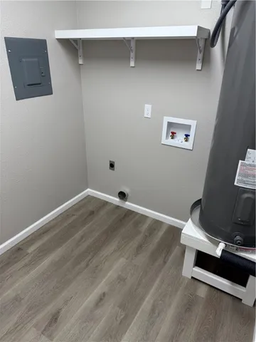 a room with a wooden floor and shoes