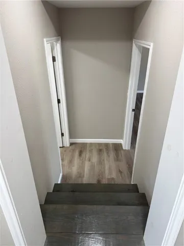 a view of staircase with white walls