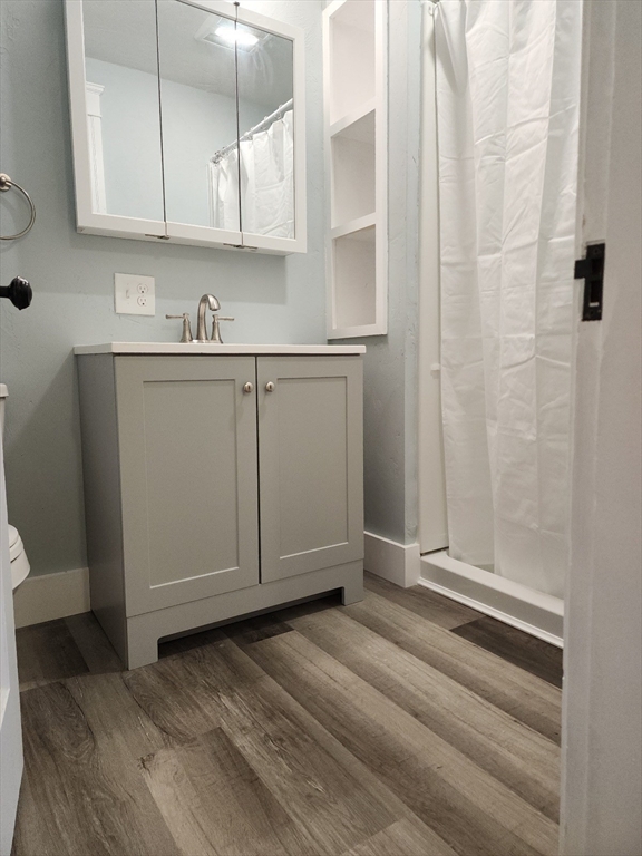 63 Fifth Avenue, Unit 1 Worcester, MA 01607 - Photo 11 of 13 a view of cabinets and wooden floor